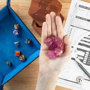 Fuchsia and Gold Dice in hand